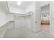 Walk-in closet with hanging rods, drawers and access to bathroom at 1313 Enderbury Dr, Raleigh, NC 27614