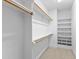 Large walk-in closet with shelves and hanging rods at 1313 Enderbury Dr, Raleigh, NC 27614