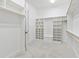 Spacious walk-in closet with built in shelves and hanging rods at 1313 Enderbury Dr, Raleigh, NC 27614