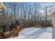 Deck with wooden railings and wooded backdrop at 1313 Enderbury Dr, Raleigh, NC 27614