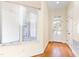 Bright entryway with hardwood floors, large windows, and exterior access at 1313 Enderbury Dr, Raleigh, NC 27614