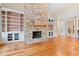 Stone fireplace with built-in shelving on either side at 1313 Enderbury Dr, Raleigh, NC 27614