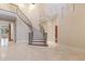 Elegant curved staircase with ornate railing at 1313 Enderbury Dr, Raleigh, NC 27614