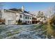 Large two-story house with a side view of the home, a large backyard, and light dusting of snow at 1313 Enderbury Dr, Raleigh, NC 27614