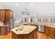 Gourmet kitchen with large island, stainless steel appliances, and hardwood floors at 1313 Enderbury Dr, Raleigh, NC 27614