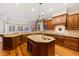 Spacious kitchen with granite countertops, custom cabinetry, and island at 1313 Enderbury Dr, Raleigh, NC 27614