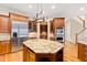 Island kitchen with stainless steel appliances and hardwood floors at 1313 Enderbury Dr, Raleigh, NC 27614