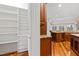 Spacious kitchen pantry with ample shelving for storage at 1313 Enderbury Dr, Raleigh, NC 27614