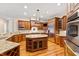 Kitchen boasts granite countertops, stainless steel appliances, and hardwood floors at 1313 Enderbury Dr, Raleigh, NC 27614