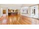 Open floor plan with hardwood floors and kitchen view at 1313 Enderbury Dr, Raleigh, NC 27614