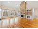 Spacious living room with hardwood floors and stone fireplace at 1313 Enderbury Dr, Raleigh, NC 27614