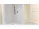 Clean shower with tiled walls and built-in seat at 1313 Enderbury Dr, Raleigh, NC 27614