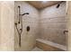 Walk-in shower with tile surround, built-in seat and multiple shower heads at 1313 Enderbury Dr, Raleigh, NC 27614