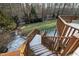 Wooden stairs leading down from deck to yard at 1313 Enderbury Dr, Raleigh, NC 27614