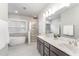 Main bathroom with soaking tub, walk-in shower, and double vanity at 172 Cotten Dr, Morrisville, NC 27560