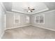 Bright bedroom with neutral walls, carpeted floors, and multiple windows at 172 Cotten Dr, Morrisville, NC 27560