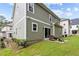 Gray siding two story house with a small patio and backyard at 172 Cotten Dr, Morrisville, NC 27560