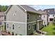 Two-story house with gray siding, a patio, and a grassy backyard at 172 Cotten Dr, Morrisville, NC 27560
