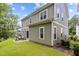 Gray siding two-story house with a backyard patio at 172 Cotten Dr, Morrisville, NC 27560