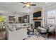 Spacious living area with fireplace, sectional sofa, and large TV at 172 Cotten Dr, Morrisville, NC 27560