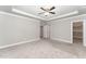 Main bedroom with ceiling fan, walk-in closet, and carpet flooring at 172 Cotten Dr, Morrisville, NC 27560