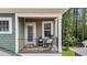 Private balcony with rocking chair and scenic wooded views at 172 Cotten Dr, Morrisville, NC 27560