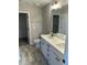 Bathroom featuring a double vanity, modern fixtures, and tiled floors for a sleek look at 185 N Movado Trl, Kenly, NC 27542