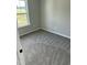 Cozy bedroom with plush carpeting, natural light from a window, and neutral paint at 185 N Movado Trl, Kenly, NC 27542