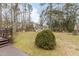 Large backyard with shed, playset, and mature trees at 1909 Pearces Rd, Zebulon, NC 27597
