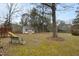 Backyard view with shed, bench, and playset at 1909 Pearces Rd, Zebulon, NC 27597