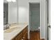Traditional bathroom features vanity with granite countertop and tub with shower at 1909 Pearces Rd, Zebulon, NC 27597