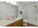Traditional bathroom features vanity with granite countertop and tub with shower at 1909 Pearces Rd, Zebulon, NC 27597