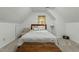 Cozy bedroom with natural light, comfortable carpet, and a decorative wooden chest at 1909 Pearces Rd, Zebulon, NC 27597