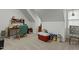 Bonus room features a desk with chair and a storage area with books at 1909 Pearces Rd, Zebulon, NC 27597