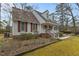 Side view of a charming house with a well-maintained lawn at 1909 Pearces Rd, Zebulon, NC 27597