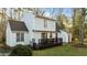 Rear view of the home featuring a deck and siding at 1909 Pearces Rd, Zebulon, NC 27597