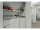 Laundry room features white washer and dryer with storage shelve at 1909 Pearces Rd, Zebulon, NC 27597