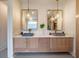 Modern bathroom with double vanity, large mirrors, and wood cabinets at 2011 Angier Ave, Durham, NC 27703