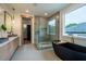 Spa-like bathroom with freestanding tub, walk-in shower, and double vanity at 2011 Angier Ave, Durham, NC 27703