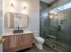Modern bathroom with a walk-in shower, floating vanity, and gray tile at 2011 Angier Ave, Durham, NC 27703