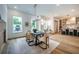 Bright dining room with hardwood floors and large windows at 2011 Angier Ave, Durham, NC 27703