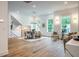 Bright dining room with hardwood floors and modern light fixture at 2011 Angier Ave, Durham, NC 27703