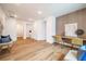 Light-filled hallway with hardwood floors and access to bedrooms at 2011 Angier Ave, Durham, NC 27703