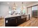Modern kitchen with farmhouse sink, stainless steel appliances, and large island at 2011 Angier Ave, Durham, NC 27703