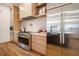Modern kitchen with stainless steel appliances and light wood cabinets at 2011 Angier Ave, Durham, NC 27703