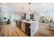 Open concept kitchen with large island, stainless steel appliances, and hardwood floors at 2011 Angier Ave, Durham, NC 27703