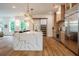 Eat-in kitchen with marble countertop island, stainless steel appliances, and hardwood floors at 2011 Angier Ave, Durham, NC 27703