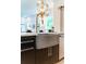 Modern kitchen features a concrete farmhouse sink and gold faucet at 2011 Angier Ave, Durham, NC 27703