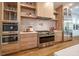 Modern kitchen with stainless steel appliances and light wood cabinets at 2011 Angier Ave, Durham, NC 27703
