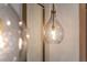 Close-up of a modern, glass pendant light fixture at 2011 Angier Ave, Durham, NC 27703
